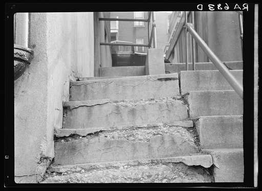 View showing disintegration of concrete stairs at the Model Housing Corporation, Cincinnati, Ohio