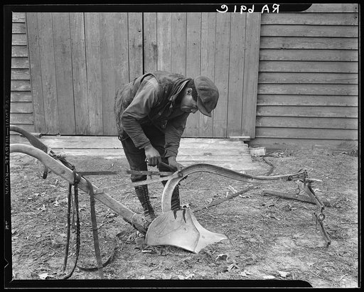 Mending a plow which has been bought through funds advanced by the Resettlement Administration. Virginia
