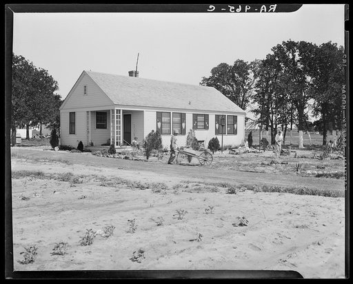 Homesteaders at work in front of their new house. Dallas, Texas