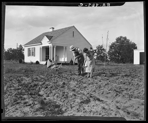 Homesteaders at work in front of their new house at Dallas, Texas