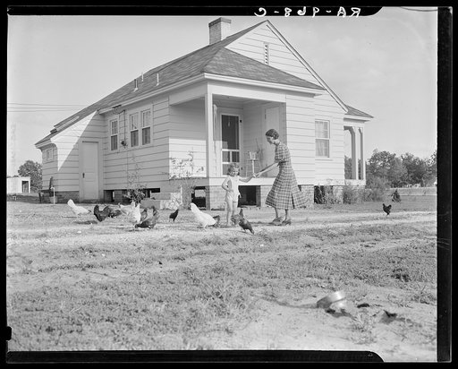 Homesteaders in front of their new house. Dallas, Texas