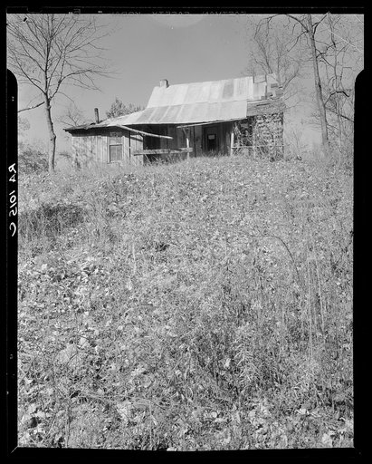 Abandoned house of a resettled farmer who is now moved into a neighboring county. Brown County, Indiana