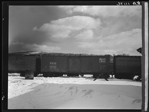 Freightcars in yards of farmers' cooperative. White River Junction, Vermont