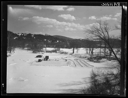 Cutting ice on the Ottauquechee River. Coos County, New Hampshire