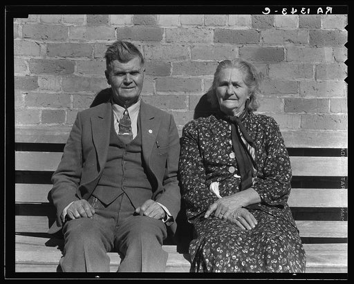 Latter Day Saints portrait group. These people, man and wife, are both eighty-five years old. Converts to Mormonism from South Africa. She was the first schoolteacher in Escalante. They are dressed in their Sunday clothes