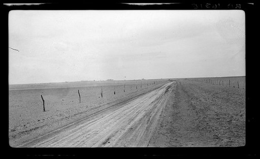 Typical view of the rolling character of the area. Town of Mills in distance, New Mexico