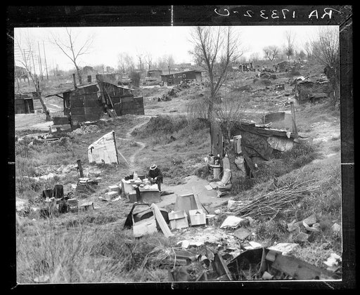 Migrant workers' camp, outskirts of Marysville, California. The new migratory camps now being built by the Resettlement Administration will remove people from unsatisfactory living conditions such as these and substitute at least the minimum of comfort and sanitation