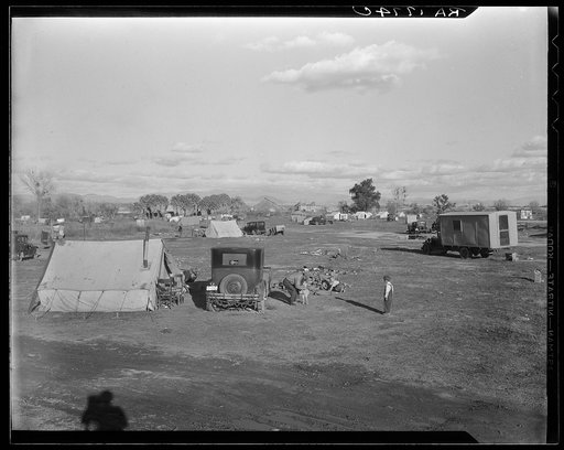 Hooverville of Bakersfield, California. A rapidly growing community of people living rent-free on the edge of the town dump in whatever kind of shelter available. Approximately one thousand people now living here and raising children