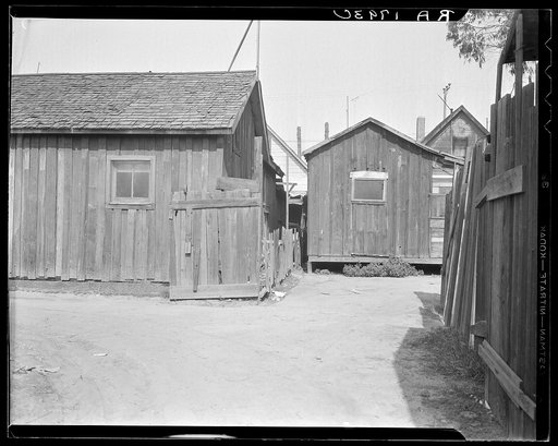 Mexican quarter of Los Angeles. One quarter mile from City Hall. Areas have been condemned and will be torn down shortly to make space for the new Union Railroad station. Average rental eight dollars. Some of the houses have plumbing
