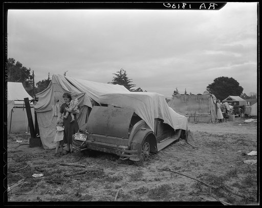 Migrant family looking for work in the pea fields. California