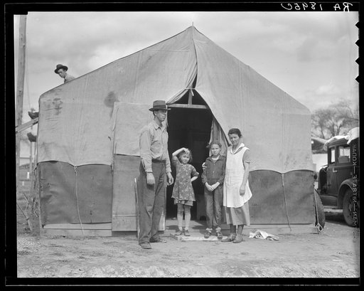 Migrant family in Kern County. This family was sent back at the state line by the Los Angeles police. Refused entrance into California, and it was only after they had gone back to Arkansas to borrow fifty dollars cash to show at the border that they were permitted to enter