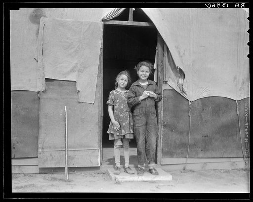 Migrant family in Kern County. This family was sent back at the state line by Los Angeles police. Refused entrance into California, and it was only after they had wired back to Arkansas to borrow fifty dollars cash to show at the border that they were permitted to enter