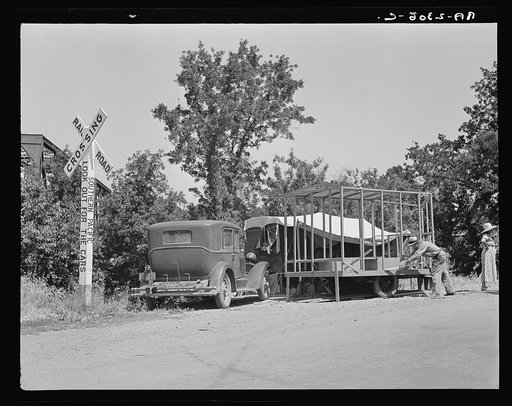 Mobile housing--a trend. One of the many housecars under construction by homeless people who formerly lived in tents. California