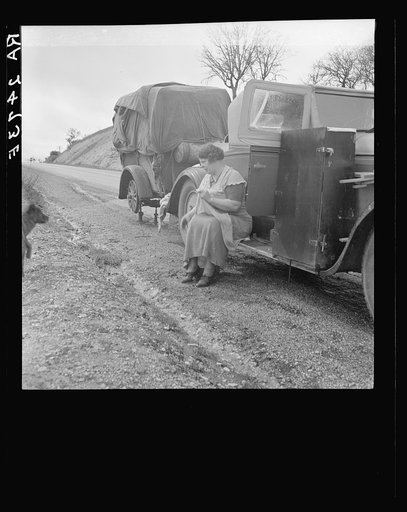 Migrant pea workers on the road. All their worldly possessions in car and trailer. California