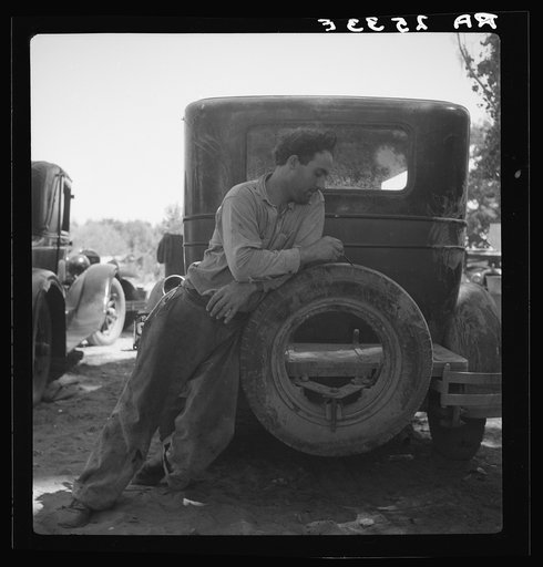 Migrant agricultural worker in Marysville migrant camp (trying to figure out his year's earnings). California