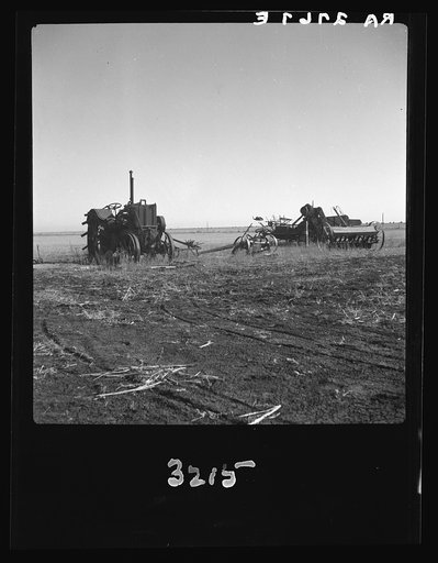 Discouraged farmers have been leaving this area over a period of years, leaving their heavy equipment in the fields. Mills, New Mexico