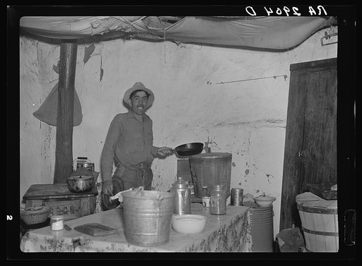 Mexican rehabilitation client inside jacal. Dona Ana County, New Mexico