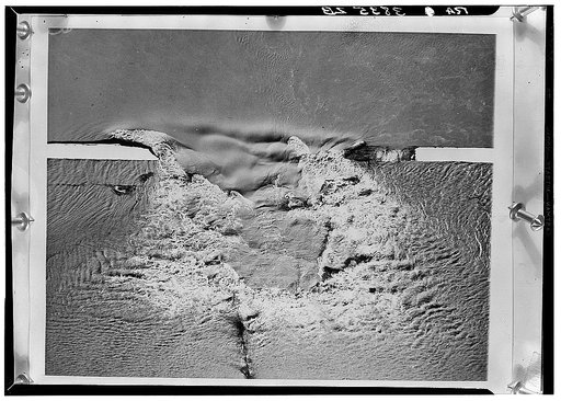 Levee being dynamited to save Cairo, Illinois, during the 1937 flood