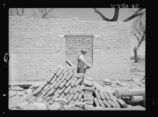 Building one of the new adobe homes. Bosque Farms, New Mexico