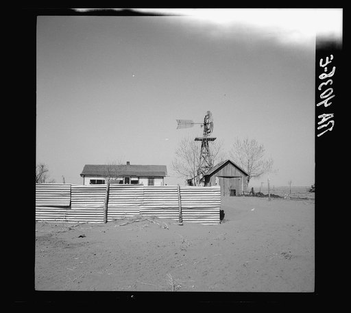 Windbreak for garden made from roof of barn. Cimarron County, Oklahoma