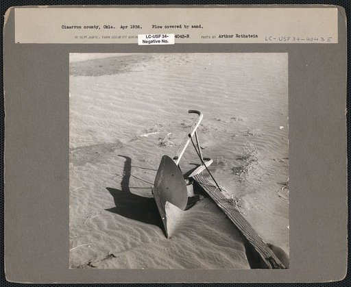 Plow covered by sand. Cimarron County, Oklahoma