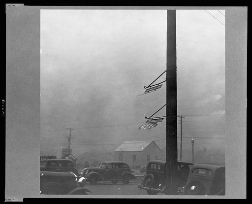 Dust storm. Note heavy metal signs blown out by wind. Amarillo, Texas