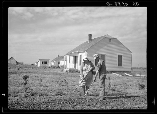 Working in garden. Falls City Farmsteads, Nebraska