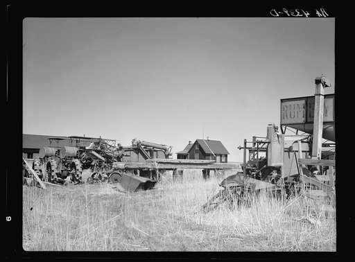 Home of wheat farmer-speculator. Cheap house and heavy investment in machinery. Box Butte County, Nebraska