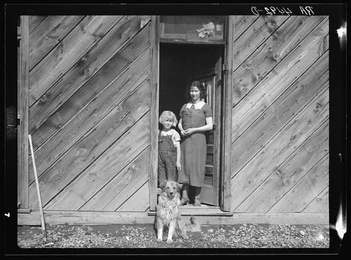 Farm wife and child who are to be removed to better farmland while present will revert to grazing land. Oneida County, Idaho