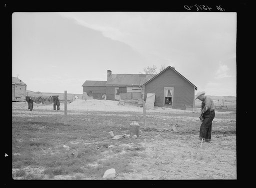 Type of house and farmer to be removed from land development area. Pennington County, South Dakota