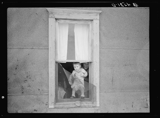 Child of family living in land development area. Pennington County, South Dakota