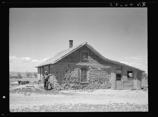 Sod house in which this man's father homesteaded thirty years ago. Pennington County, South Dakota
