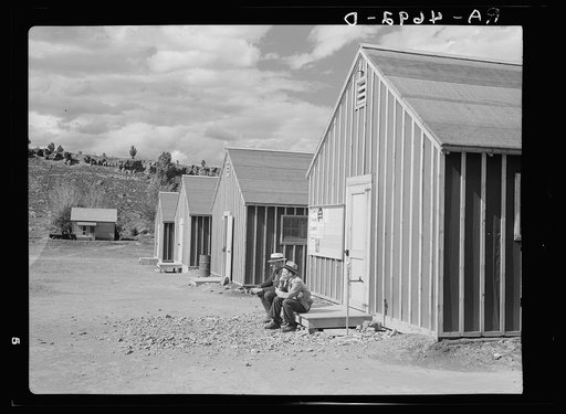 Looking down a row of bunkhouses in the Rimrock Development Camp of the Resettlement Administration in central Oregon