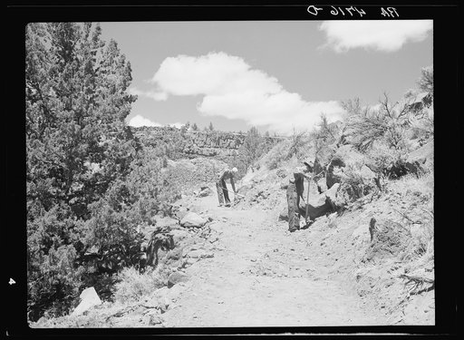 Resettlement Administration workers constructing a stock trail to the Deschutes River. Central Oregon grazing project, Oregon