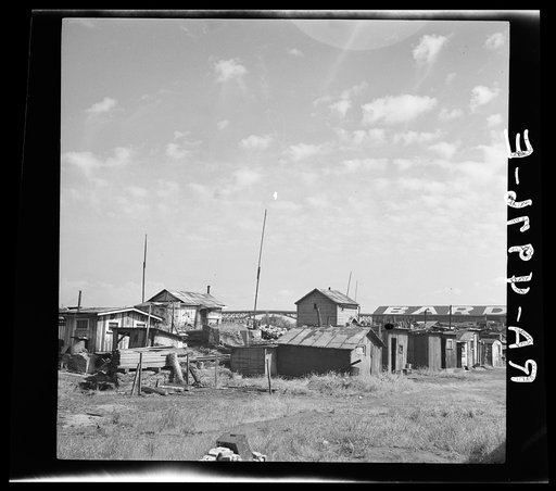 Squatters' shacks along the Willamette River. Portland, Oregon