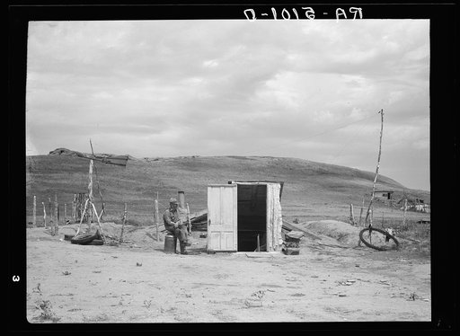 Many farmers are abandoning their homes and moving into dugouts near towns to become eligible for drought relief. Grassy Butte, North Dakota