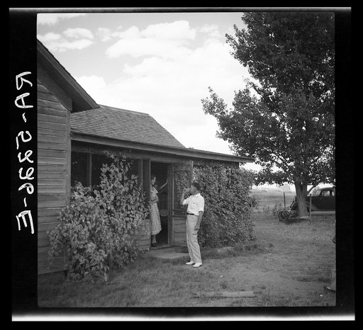 Doctor Tugwell visiting rehabilitation client's home. South Dakota