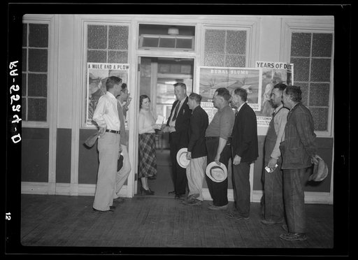 Resettlement clients arrive at the Resettlement Administration office after tobacco sale to make payments on their loans. Kinston, North Carolina