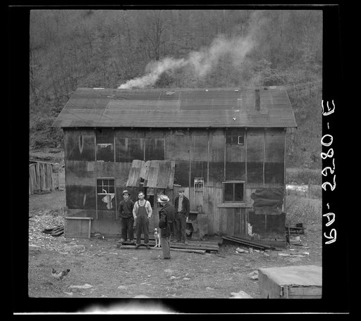 Resettlement Administration man talking to mountain people on submarginal farm. Garrett County, Maryland