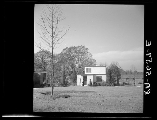 Visitors inspect a completed home. Greenbelt, Maryland
