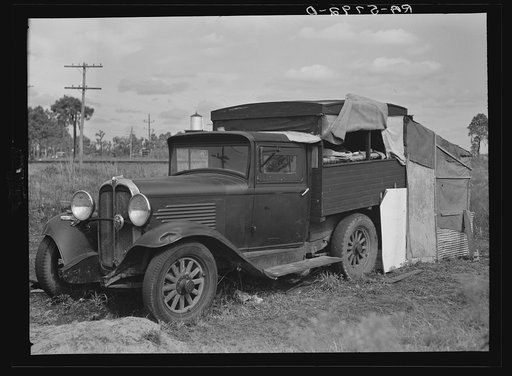 The home of a migrant family camped near a citrus packing plant in Winterhaven, Florida