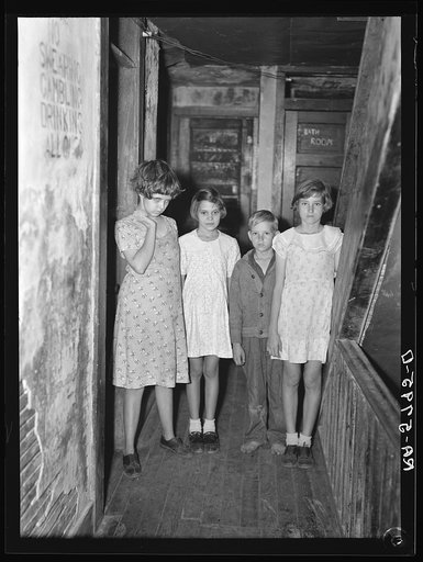 Children of citrus workers in hallway of apartment house. Winterhaven, Florida