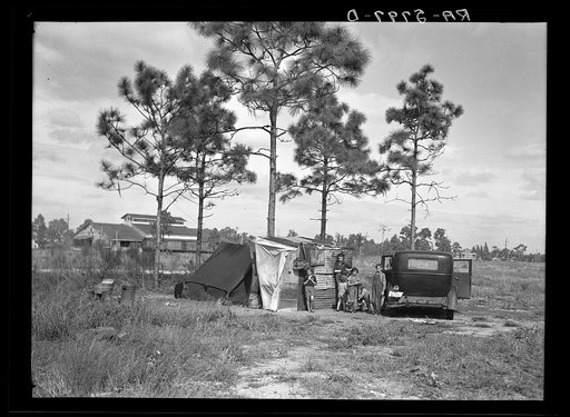 A family of eight from Tennessee camped near citrus packing plant at Winterhaven, Florida