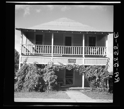 House across the street from the large packing plant in Winterhaven, Florida. Unmarried fruit workers room here