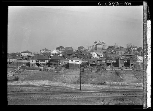 Backyards and house in Birmingham, Alabama, district from which have come some of the residents of the housing project