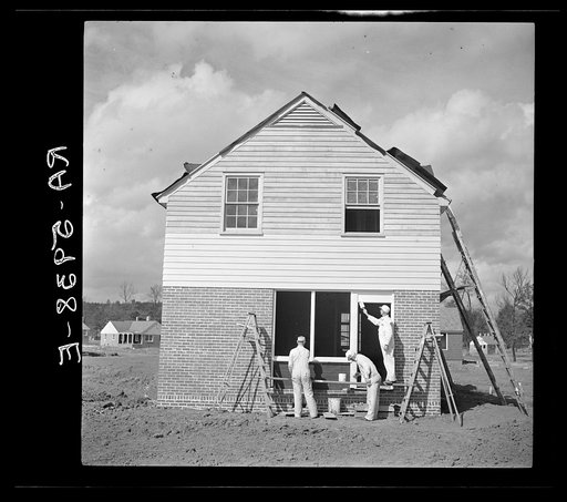 Painting one of the new houses for industrial and white collar workers of Birmingham. Slagheap Village, Alabama