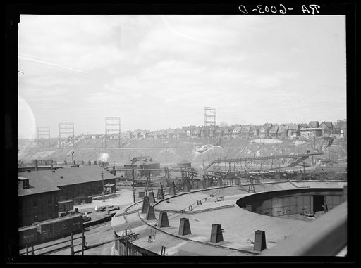 Milwaukee freight yards and industrial plants overshadowed by residential district. Milwaukee, Wisconsin