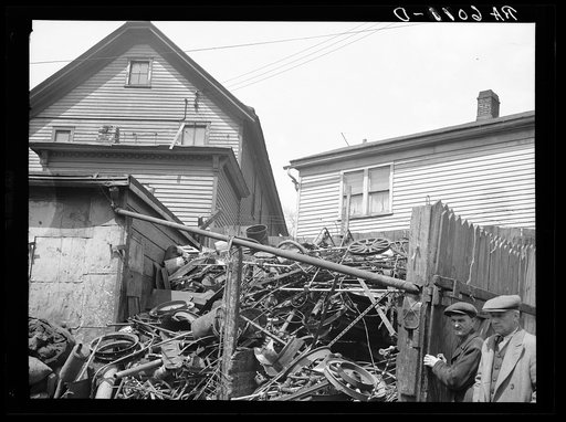 Close housing adjoining junk. Milwaukee, Wisconsin