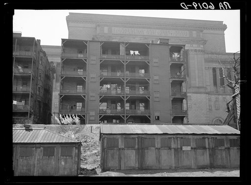 Rear of apartment house showing new Milwaukee courthouse in background. Wisconsin