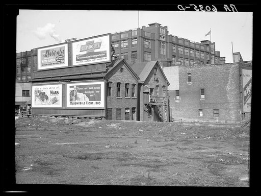 Rear of houses at 711 West State Street. Milwaukee Vocational School in background. Milwaukee, Wisconsin